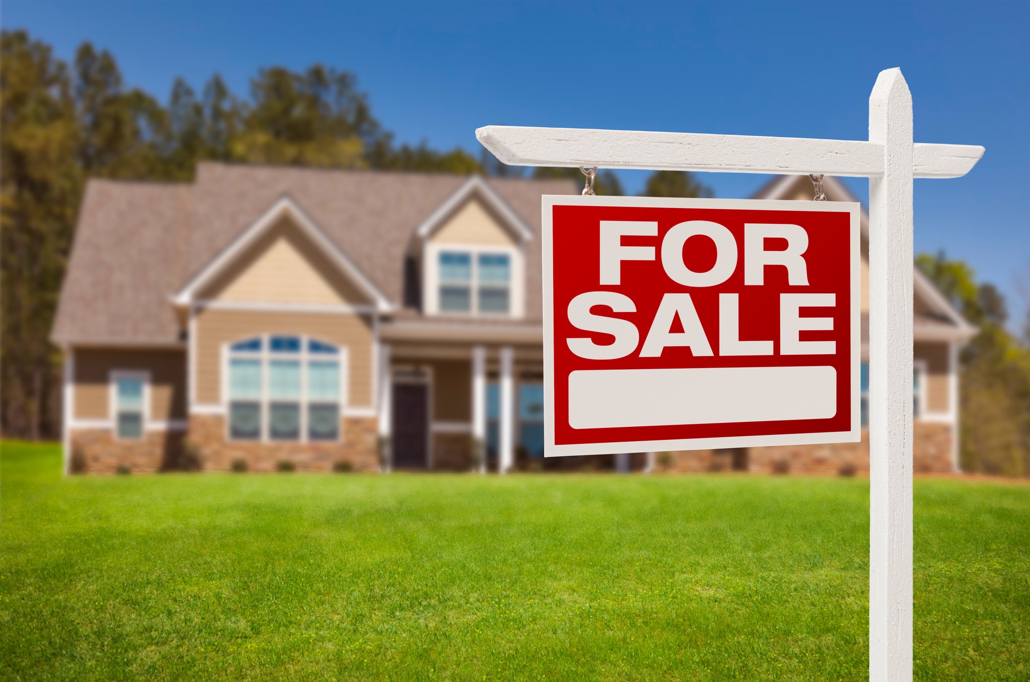 Home for Sale Sign in Front of New House